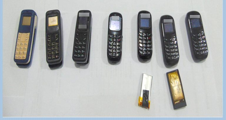 preso expeliu 7 celulares