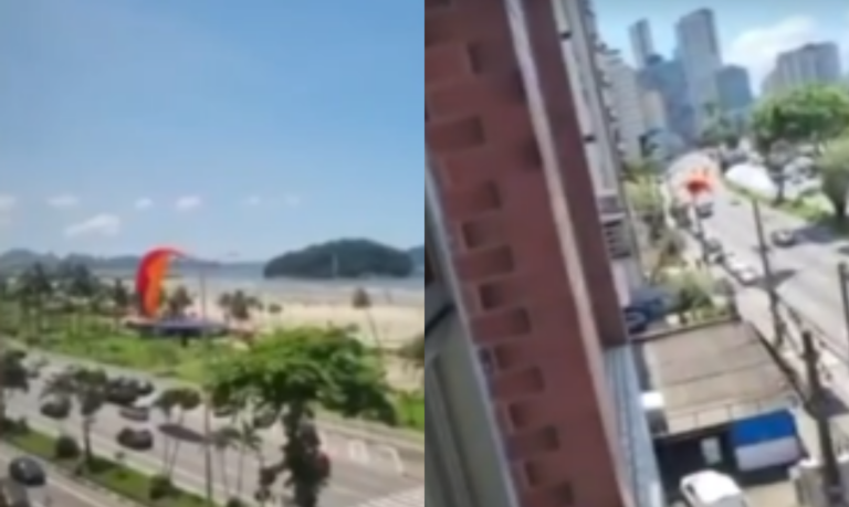 Paraglider cai e fica pendurado em poste de energia em São Vicente; VÍDEO