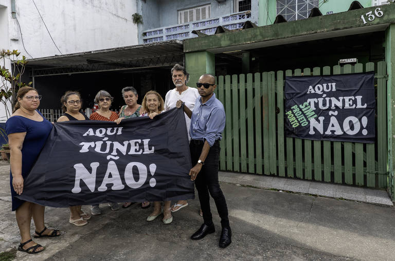 Chamados de ‘mercenários’, moradores no caminho do túnel Santos-Guarujá vivem ansiedade por imóveis