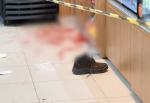 Homem invade conveniência, tenta tomar arma de guarda e é baleado
